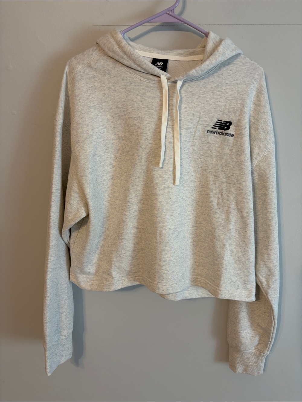 New Balance Women's Light Heather Gray Cropped Hoodie. 2. Cotton.